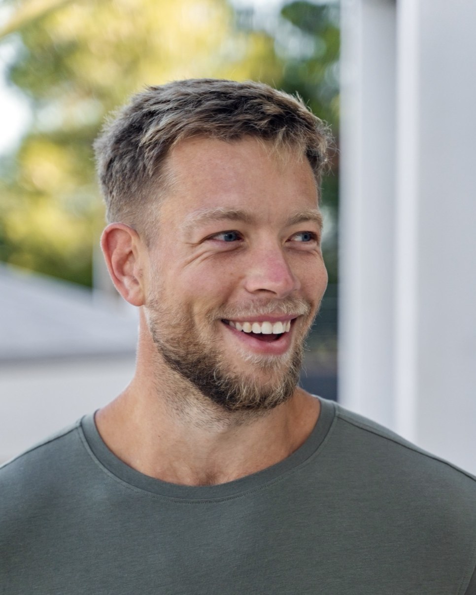 Portrait of Jonny Brakels, laughing, looking off camera